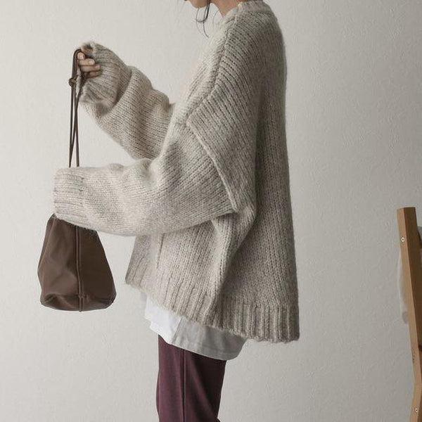 Oversized ivoorkleurige trui met voorzak