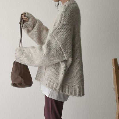 Oversized ivoorkleurige trui met voorzak