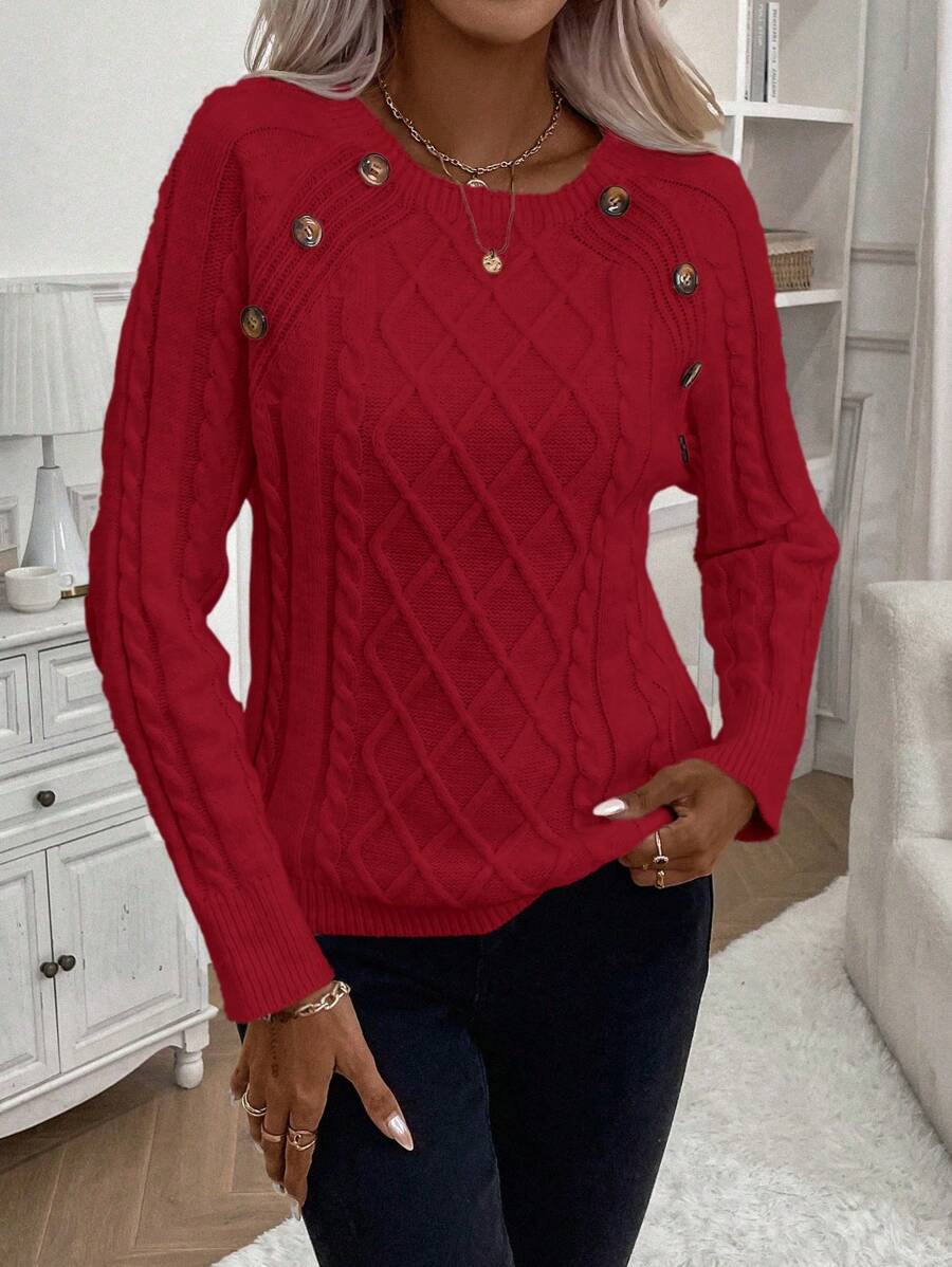 Clara – Kabelgebreide trui met knoopdetails
