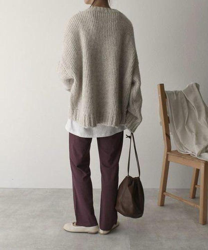 Oversized ivoorkleurige trui met voorzak