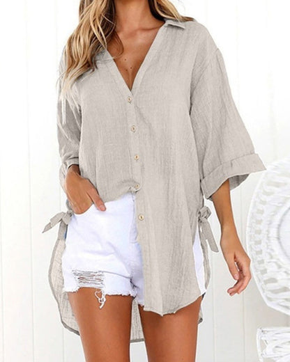 Lange blouse met strikbandjes aan de zijkanten