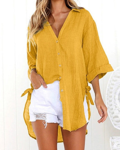 Lange blouse met strikbandjes aan de zijkanten