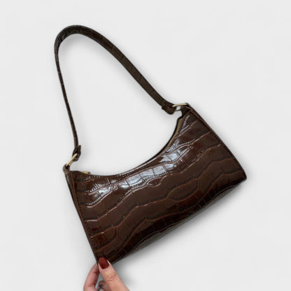 Glänzende Ledertasche