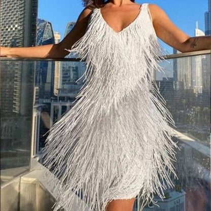 Jutte | Glitterende jurk met franjes